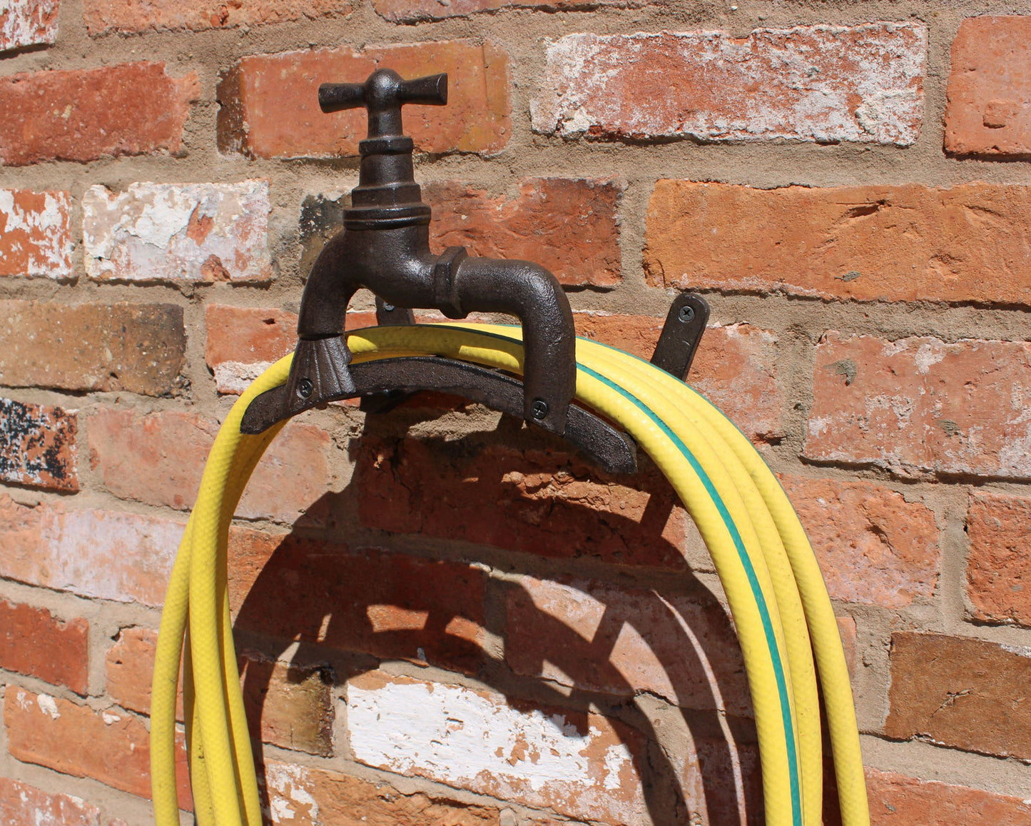 rustic-cast-iron-wall-mounted-hosepipe-holderat Willow and Wine!