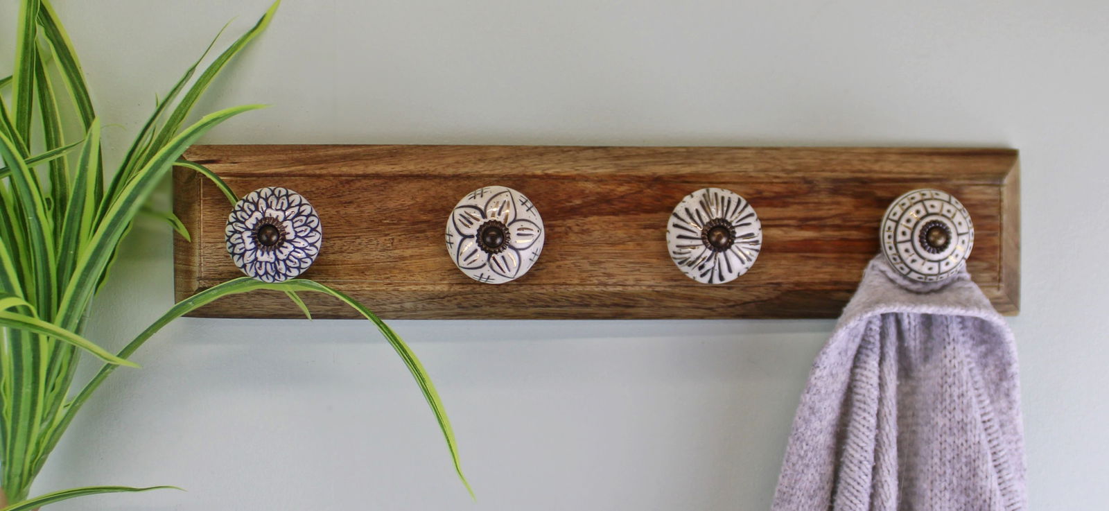 4-single-ceramic-ivory-coat-hooks-on-wooden-baseat Willow and Wine!