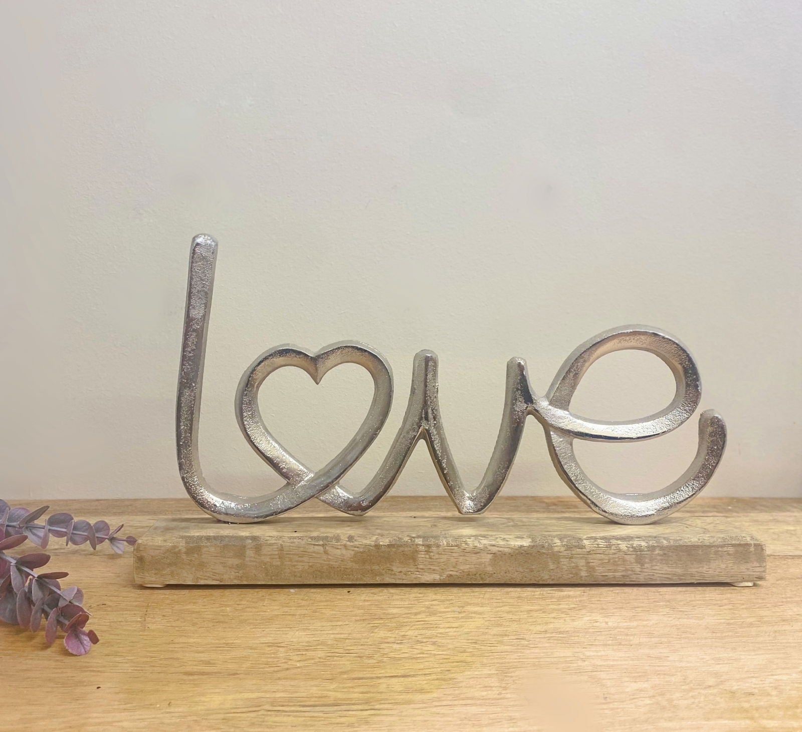 metal-silver-love-ornament-on-a-wooden-baseat Willow and Wine!